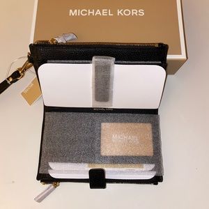Brand new Michael Kors Wristlet. Tags still on.
